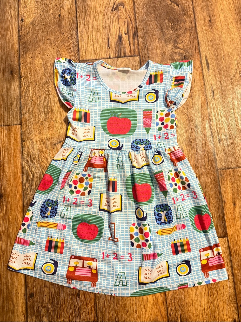 Girls Blue School-Themed Cotton Dress with Red Apple Print. Size XL (age: 5-6)